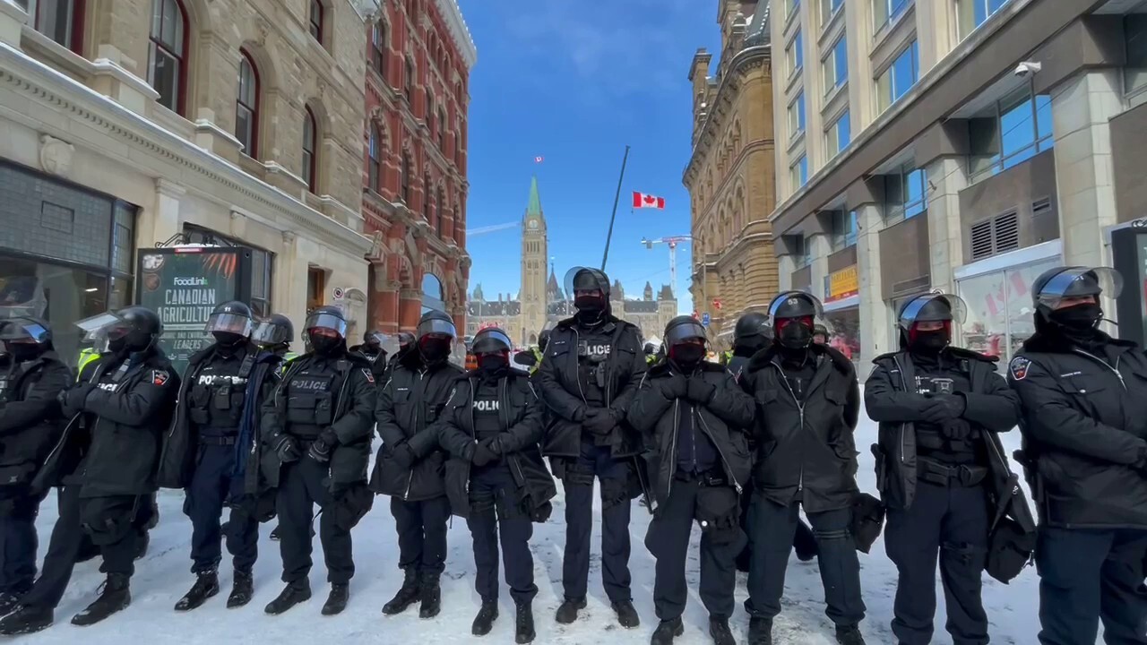 Police watch 'Freedom Convoy' protests in Ottawa