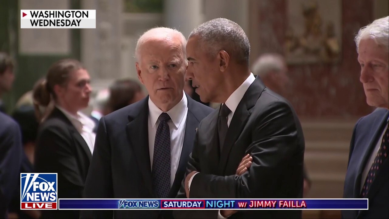 What were Biden and Obama discussing at Kennedy service?