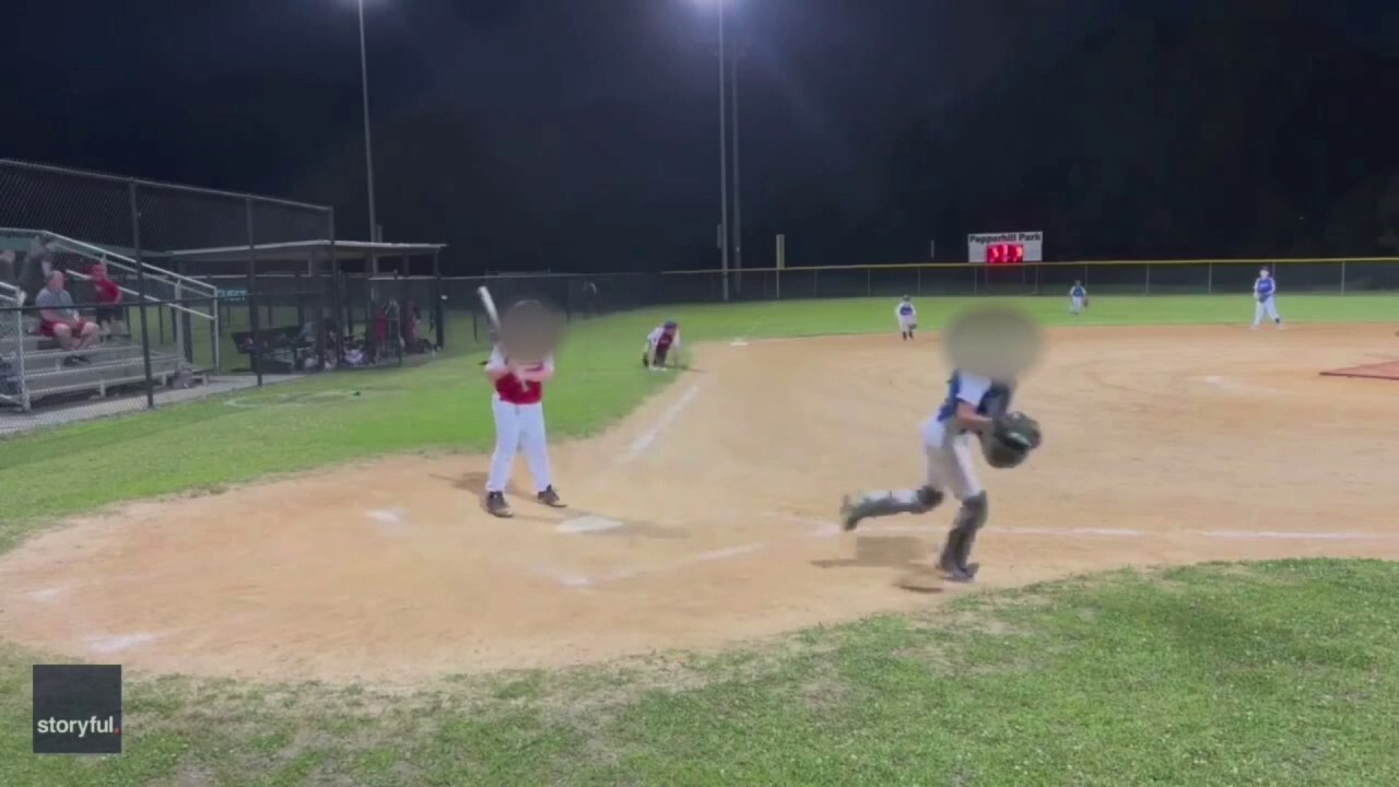 Parent films youth baseball game as shots are fired