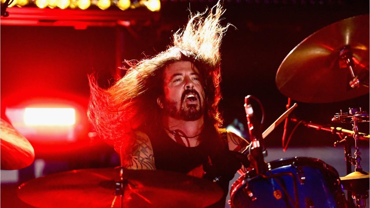 Foo Fighters' Dave Grohl chugs beer, falls off stage during recent concert