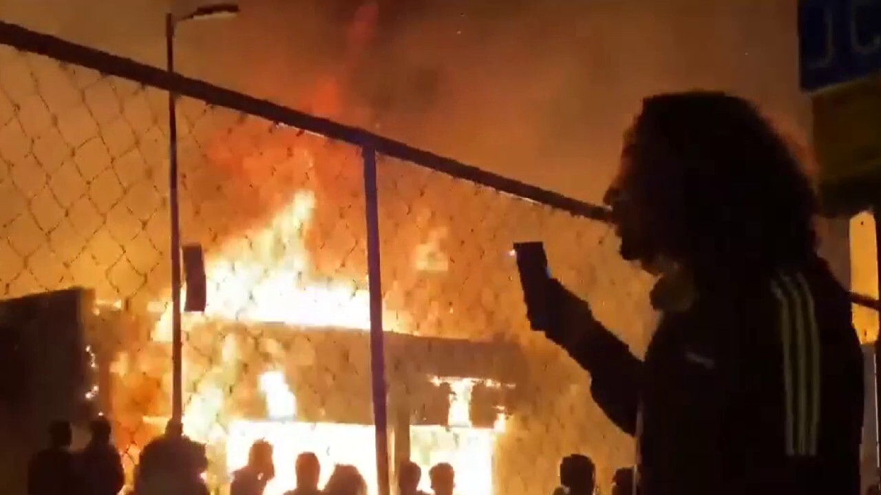 Buildings burn in Minneapolis as rioters ignore curfew order