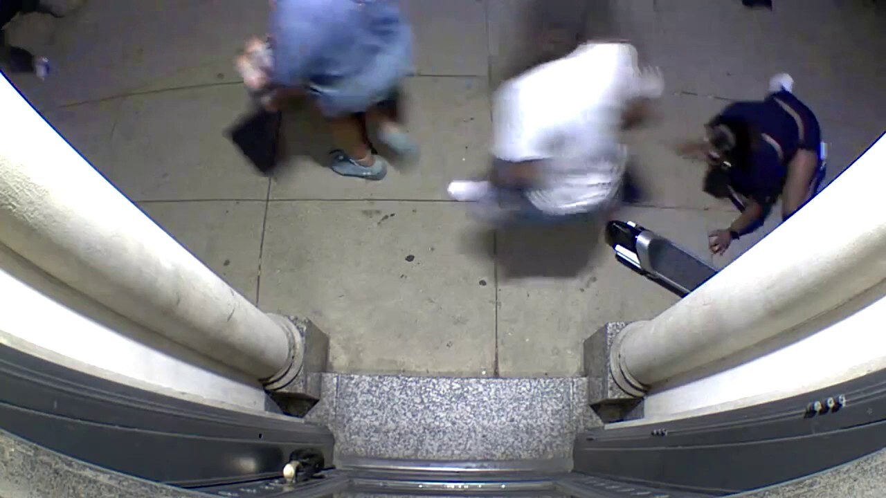 Home surveillance video shows citizens running away from gun shots