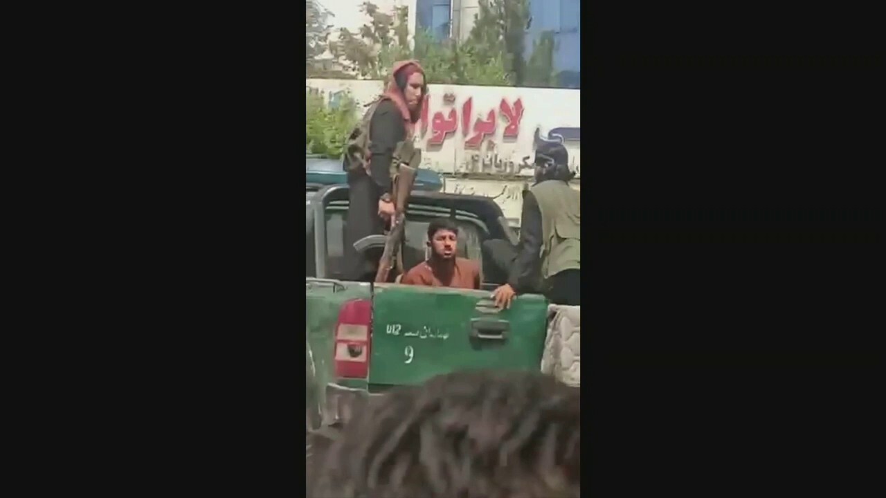 Taliban fighters beating Afghans attempting to reach airport, video shows