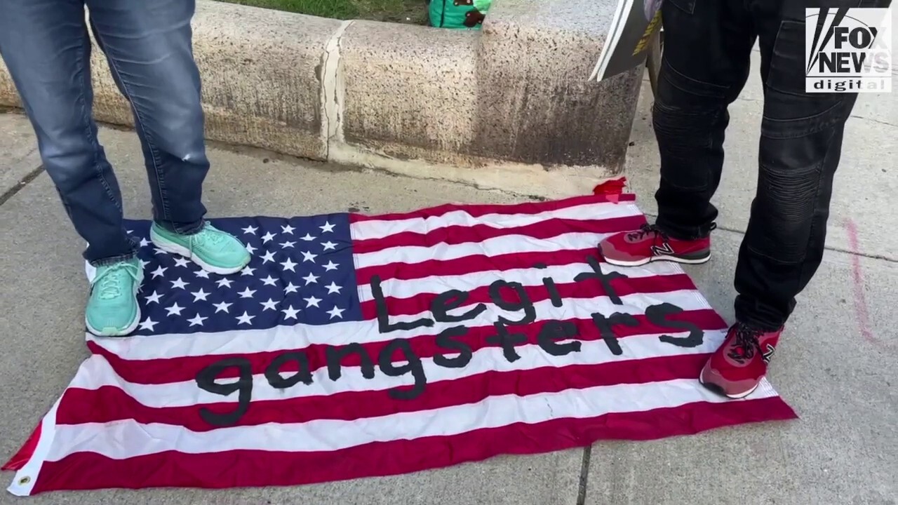 Massachusetts demonstrators stand on US flag in anti-Israeli protest