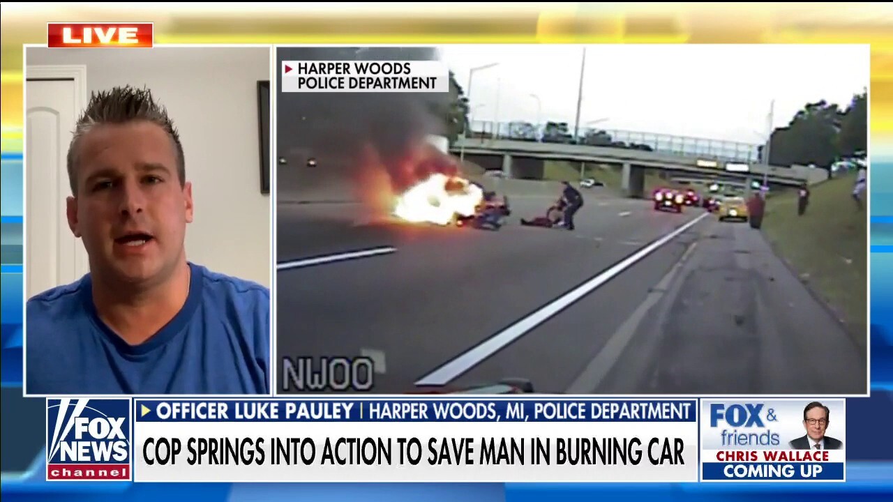  Michigan Police Officer saves man from burning car