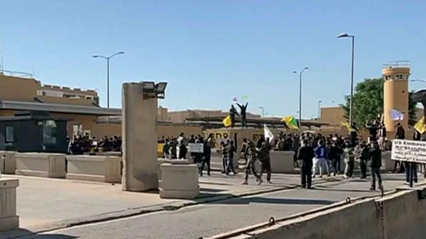 Iraqi protesters break down U.S. Embassy gate