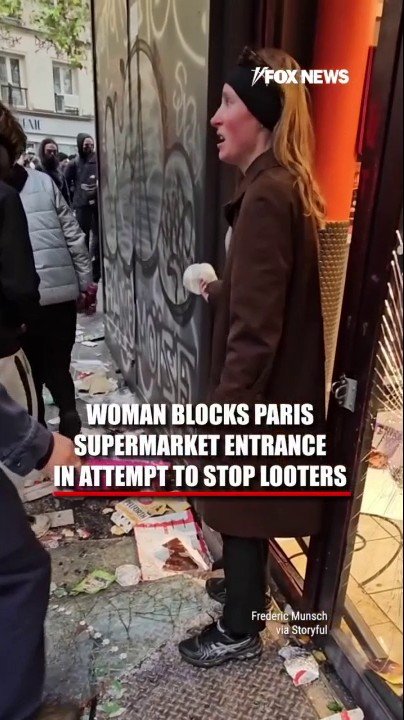 Woman steps into looters' path at Paris supermarket