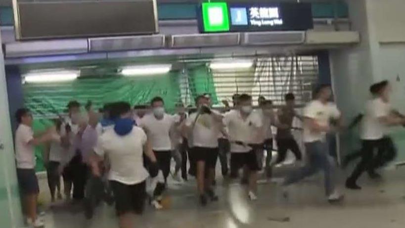 Masked attackers storm Hong Kong subway, attack commuters following pro-democracy march