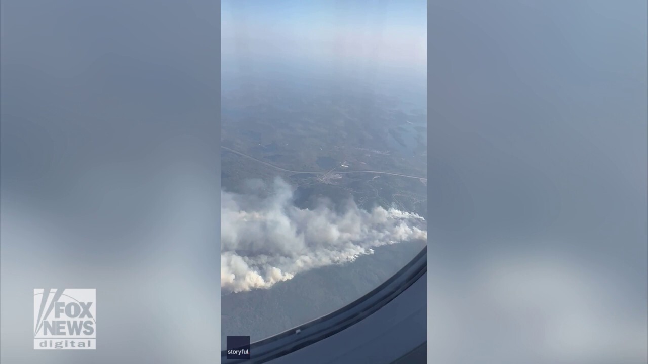 Large wildfire caught on camera from airplane window: See the video!