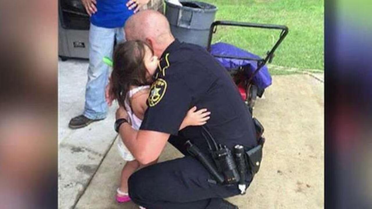 Picture of cop comforting young girl goes viral