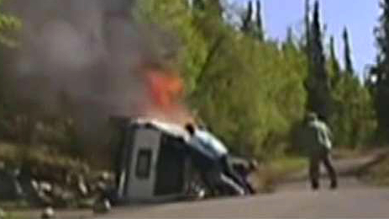 Incredible rescue: Cops, citizens lift burning truck off man