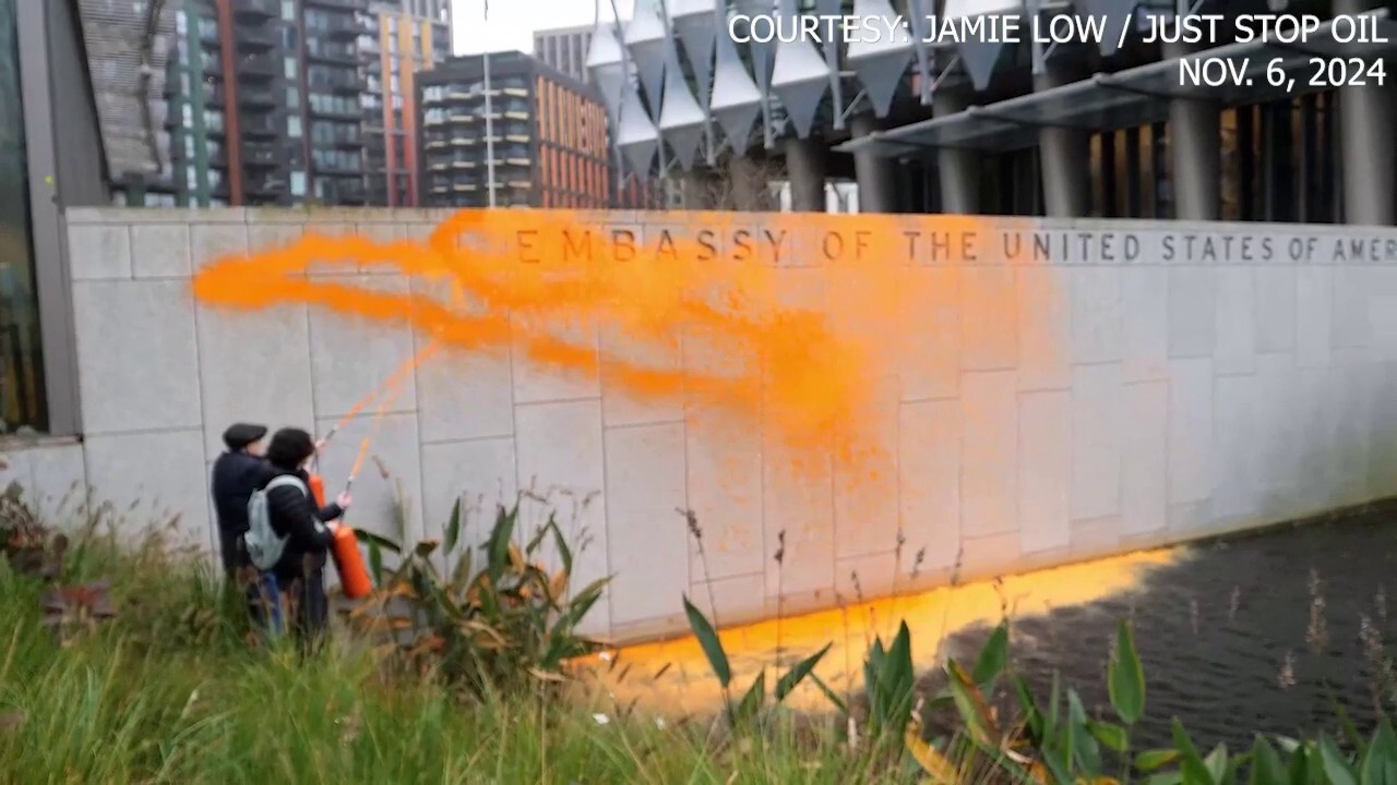 Climate activists cover US embassy in London with orange paint after Trump's projected win