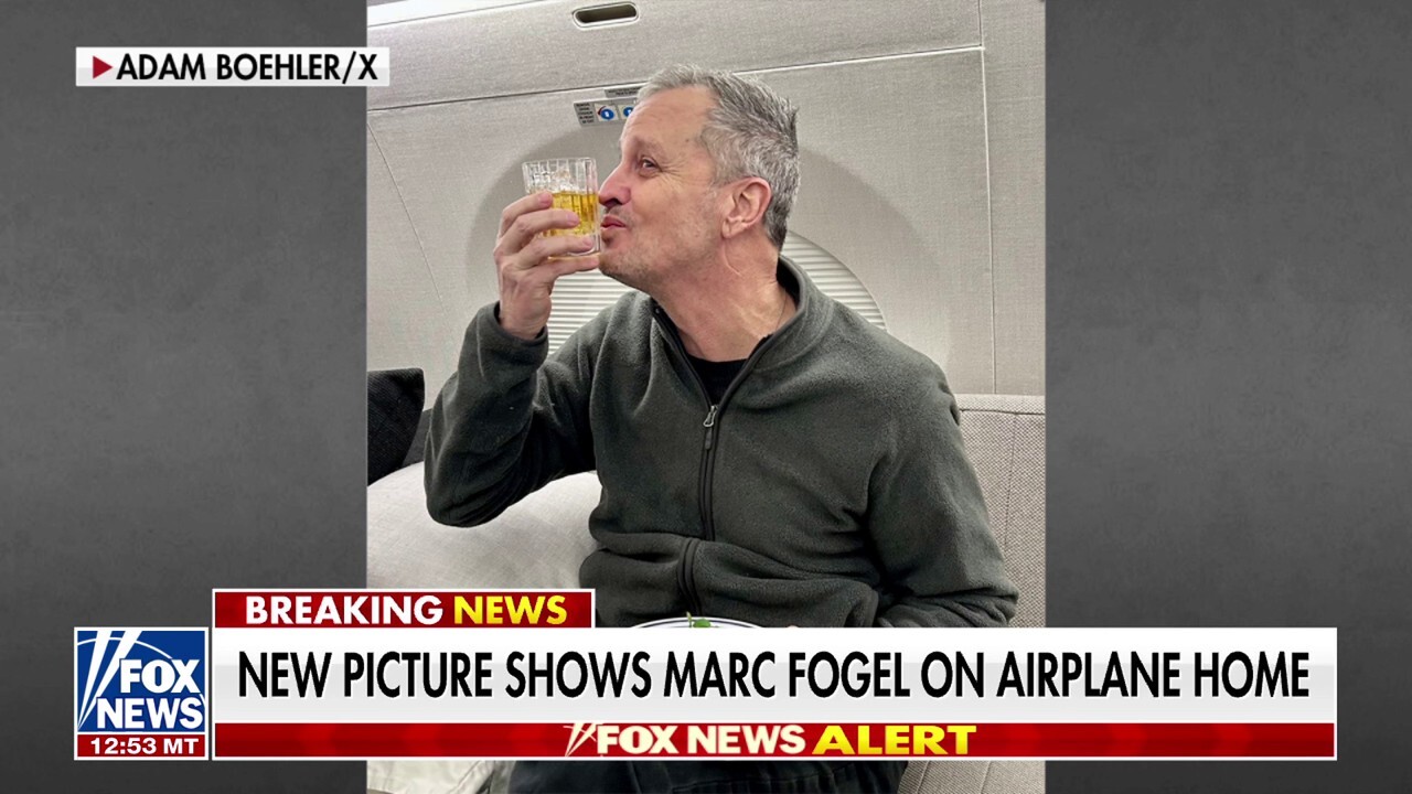 New pic shows freed American hostage Marc Fogel on plane home