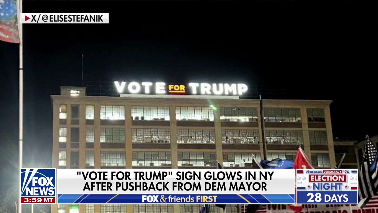 ‘Vote for Trump’ sign glows in Upstate New York after a restraining order issued by the mayor is lifted.