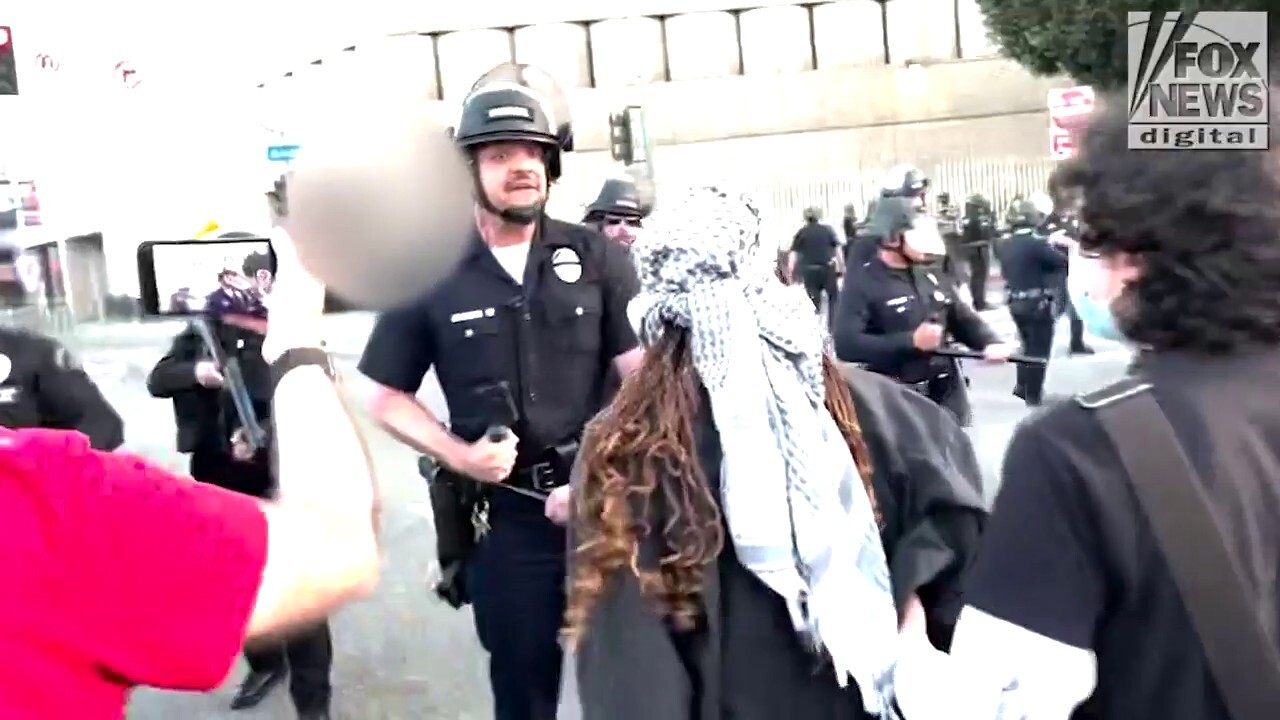 LAPD forces protesters back amid heated confrontation