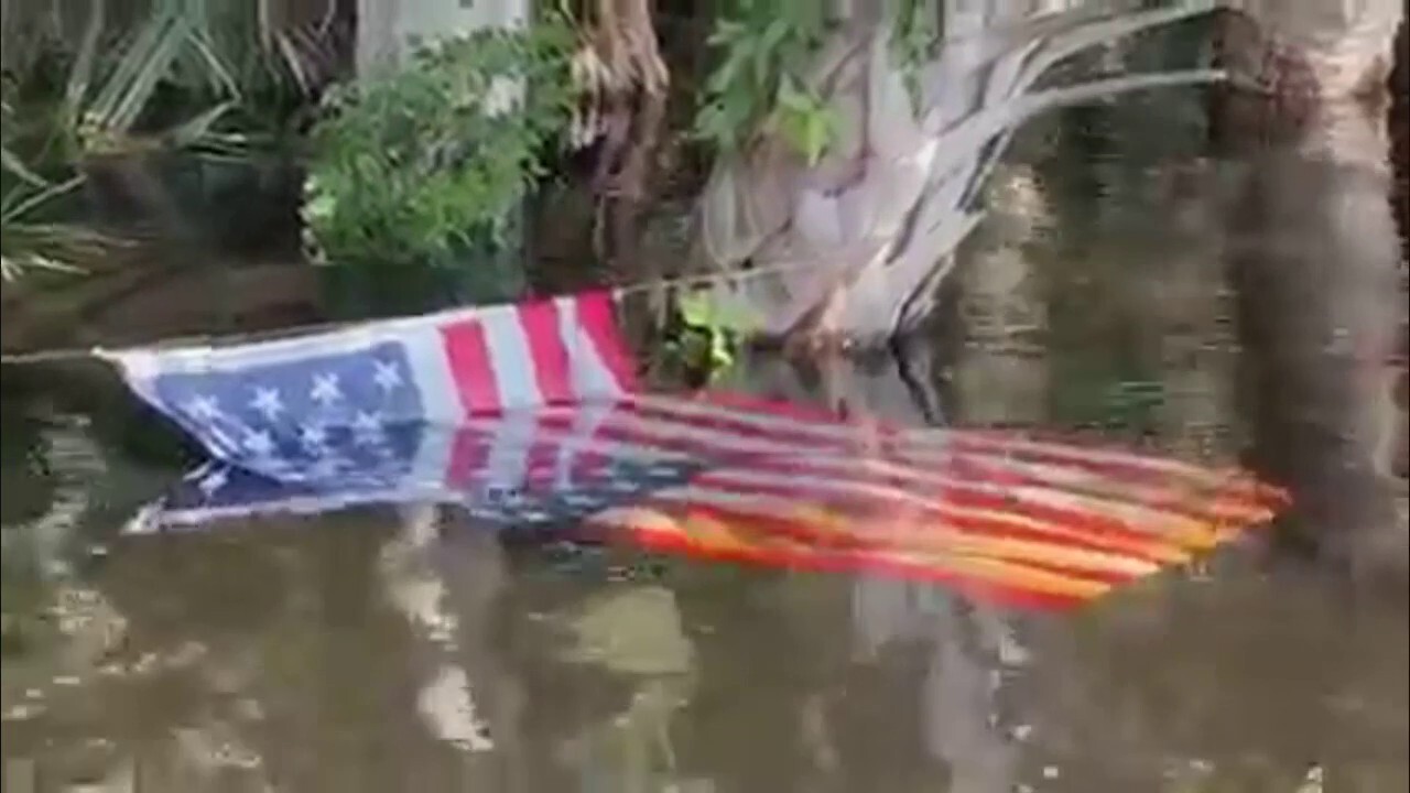 Florida deputies rescue American flag from flooded river after Hurricane Ian