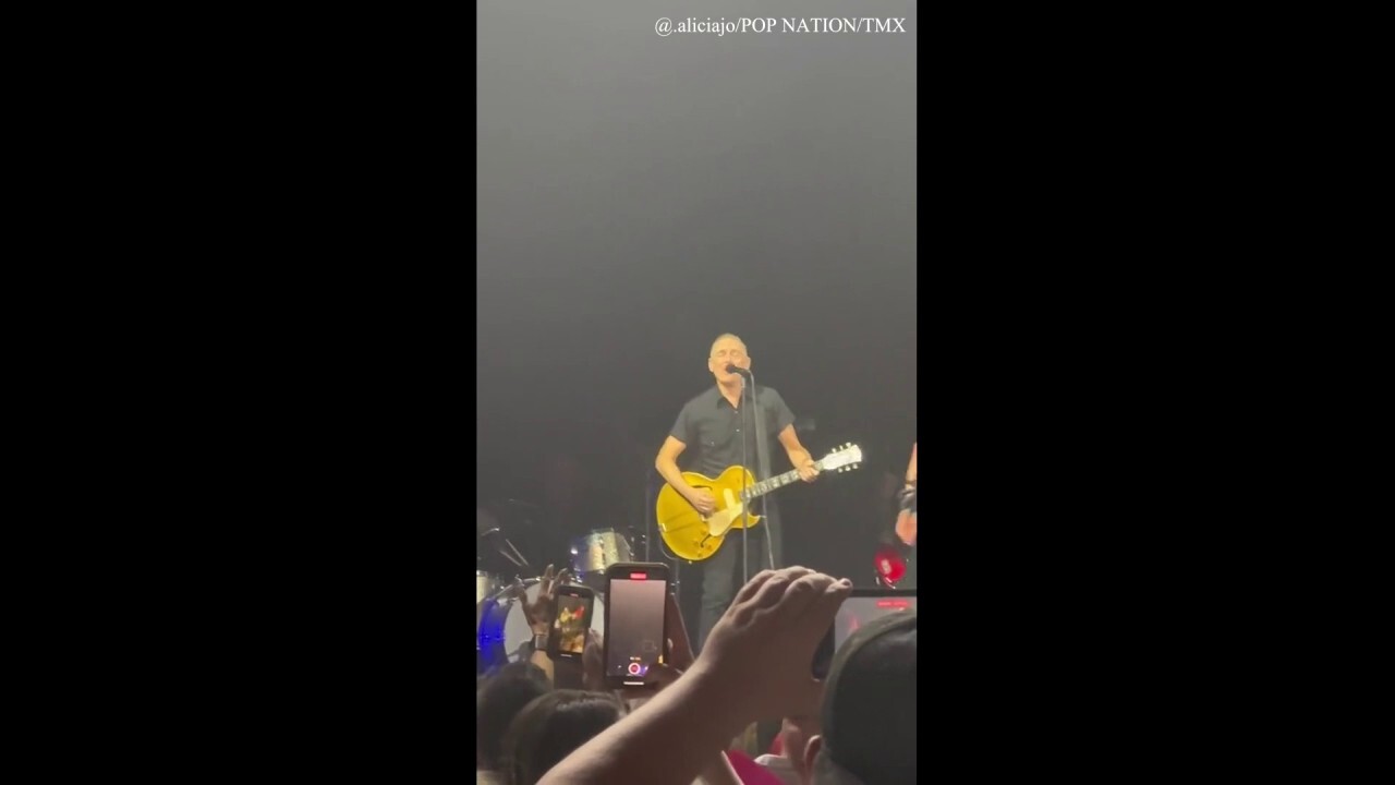 Bryan Adams interrupted by a fan while performing 'Summer of '69'
