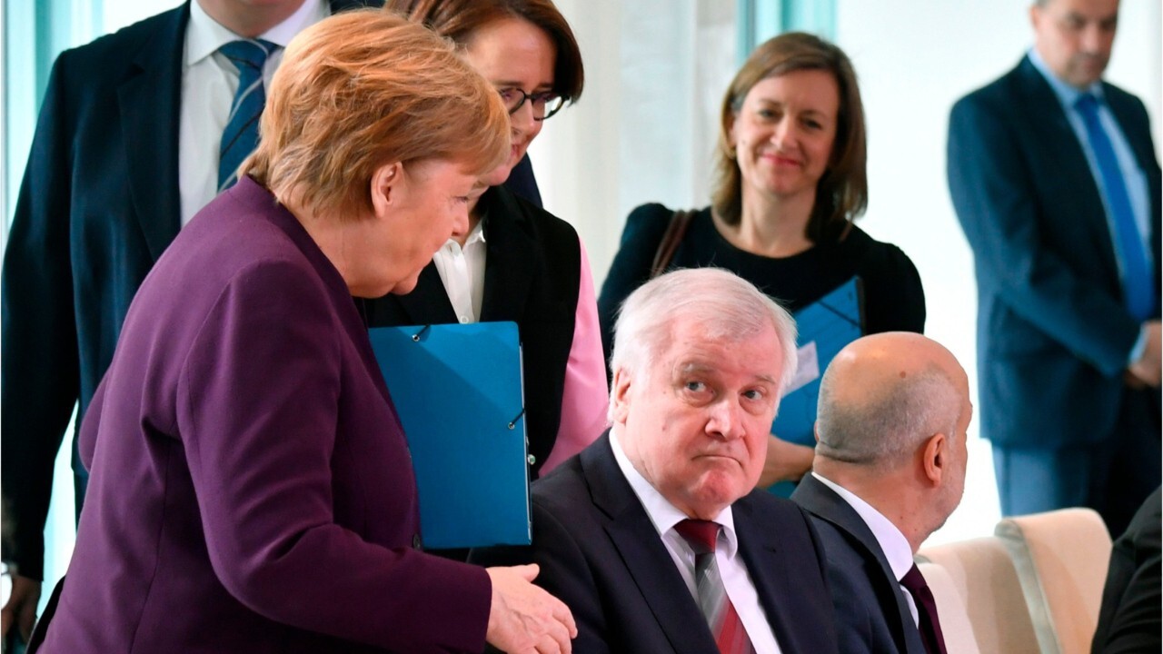 Angela Merkel rebuffed an attempted handshake with Germany interior minister