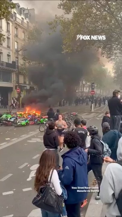 UNFAZED jogger casually runs through DESTRUCTION during Paris RIOTS