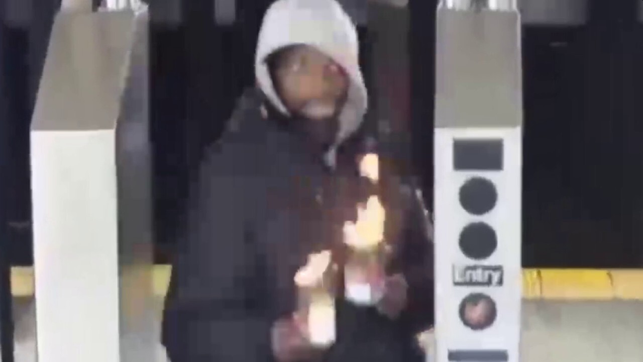 VIDEO: Man throws cans of fire at strangers in NYC subway station