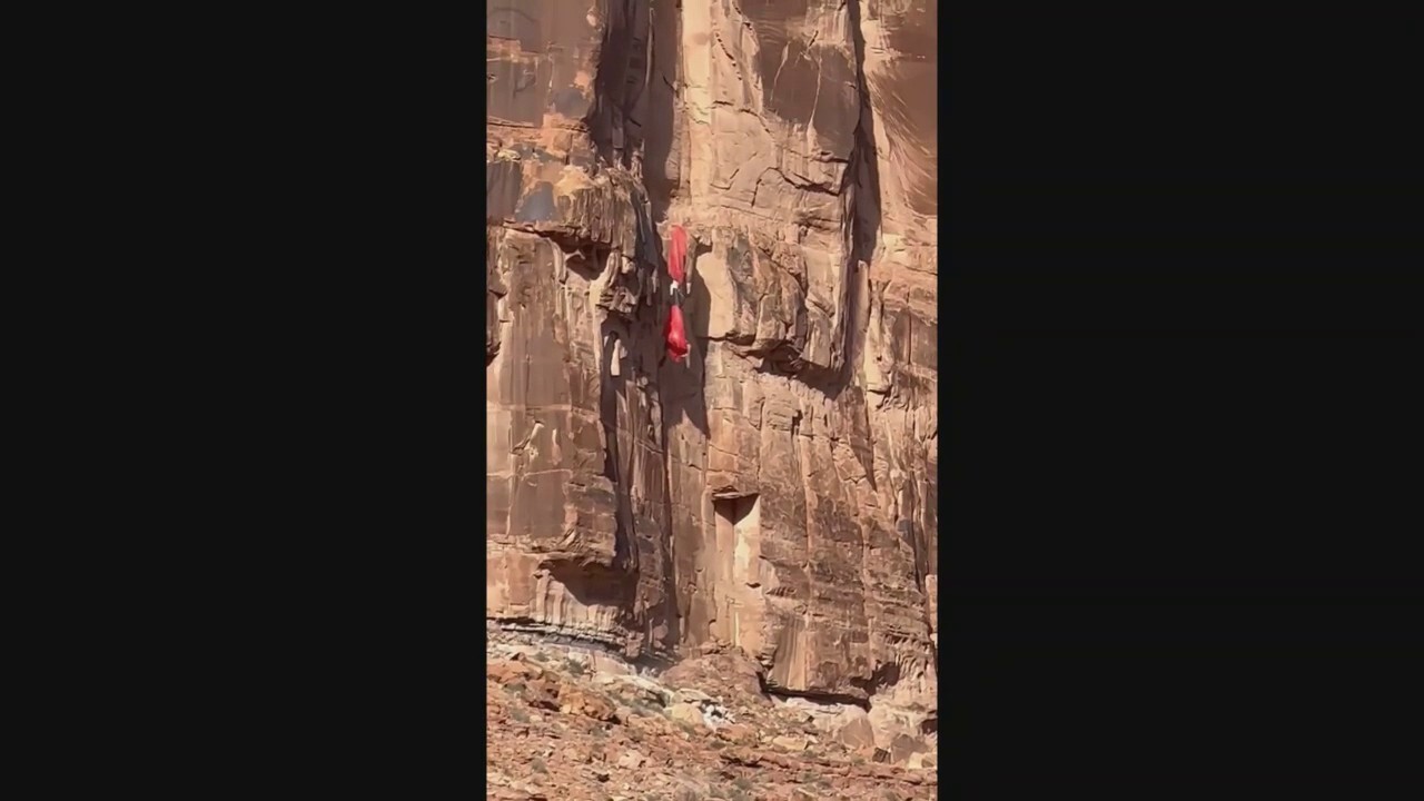 Utah BASE jumper slams into cliff, suspended on ledge in harrowing video