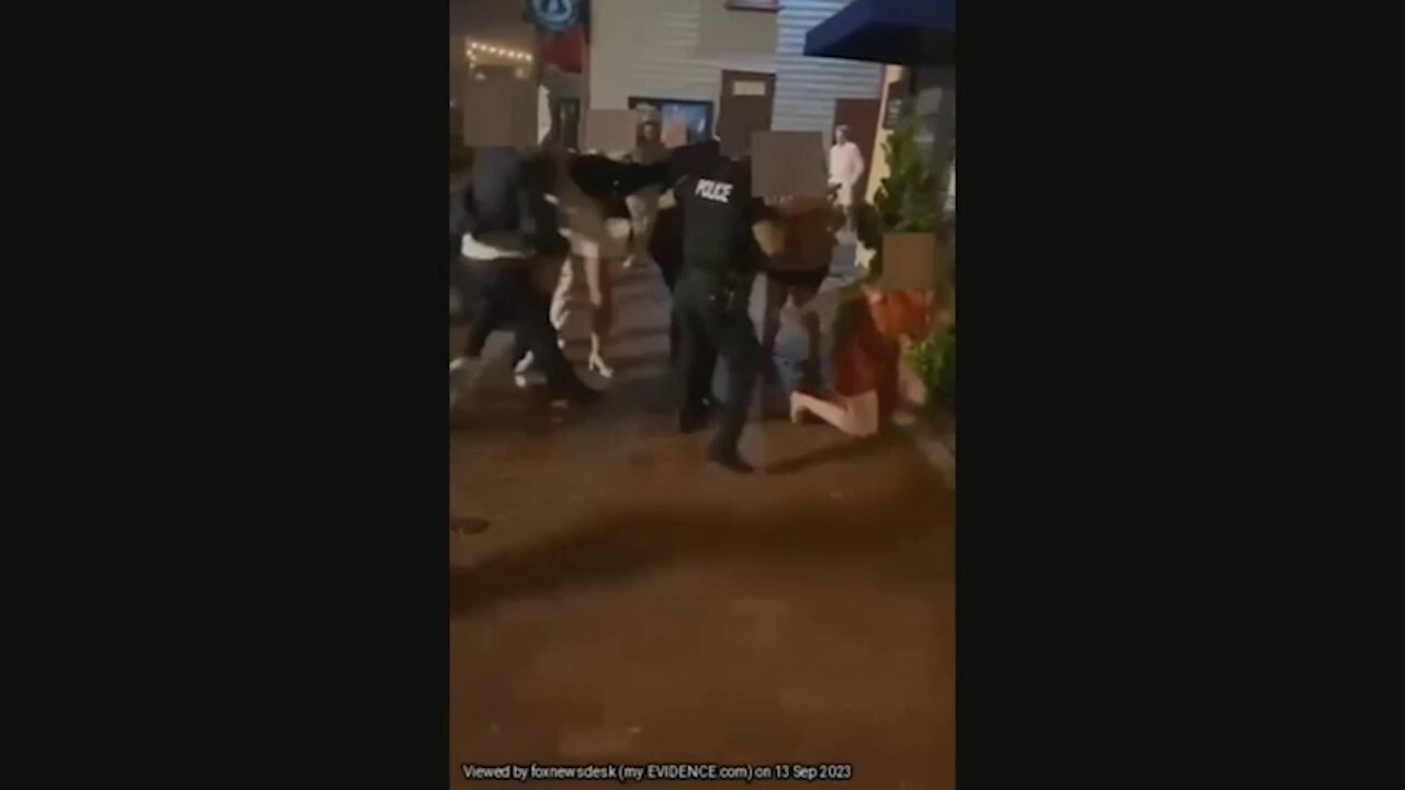 Cops caught up in street brawl with multiple wedding party members