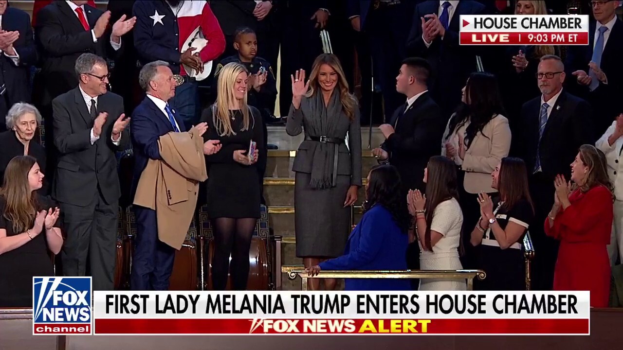 First lady Melania Trump enters House Chamber to standing ovation