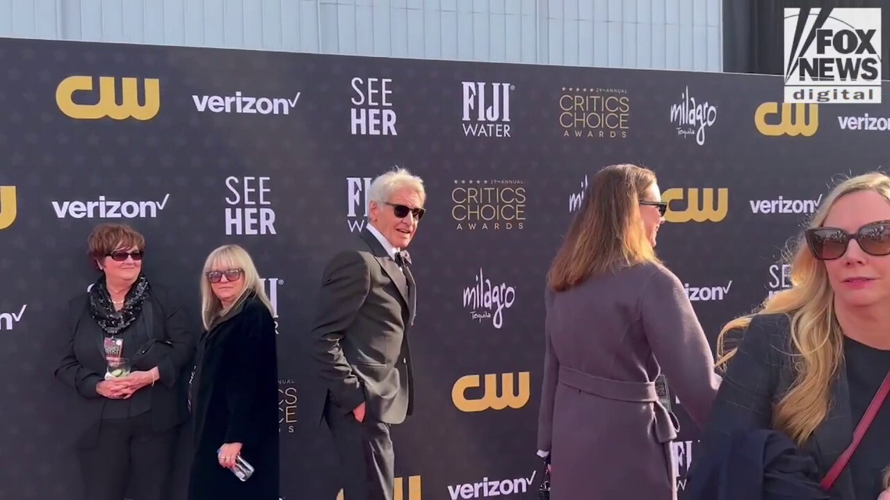 Harrison Ford walks the red carpet a the 2024 Critics Choice Awards