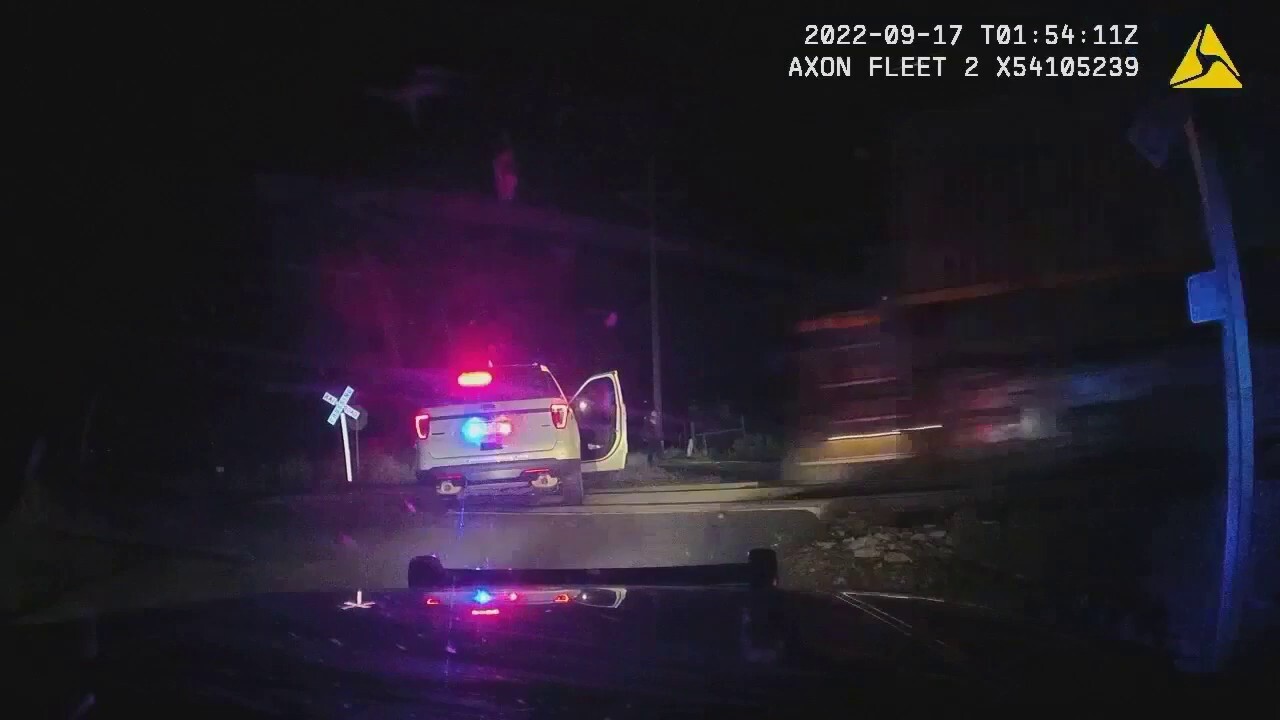 Body cam footage shows train hit Colorado officer’s car with suspect inside