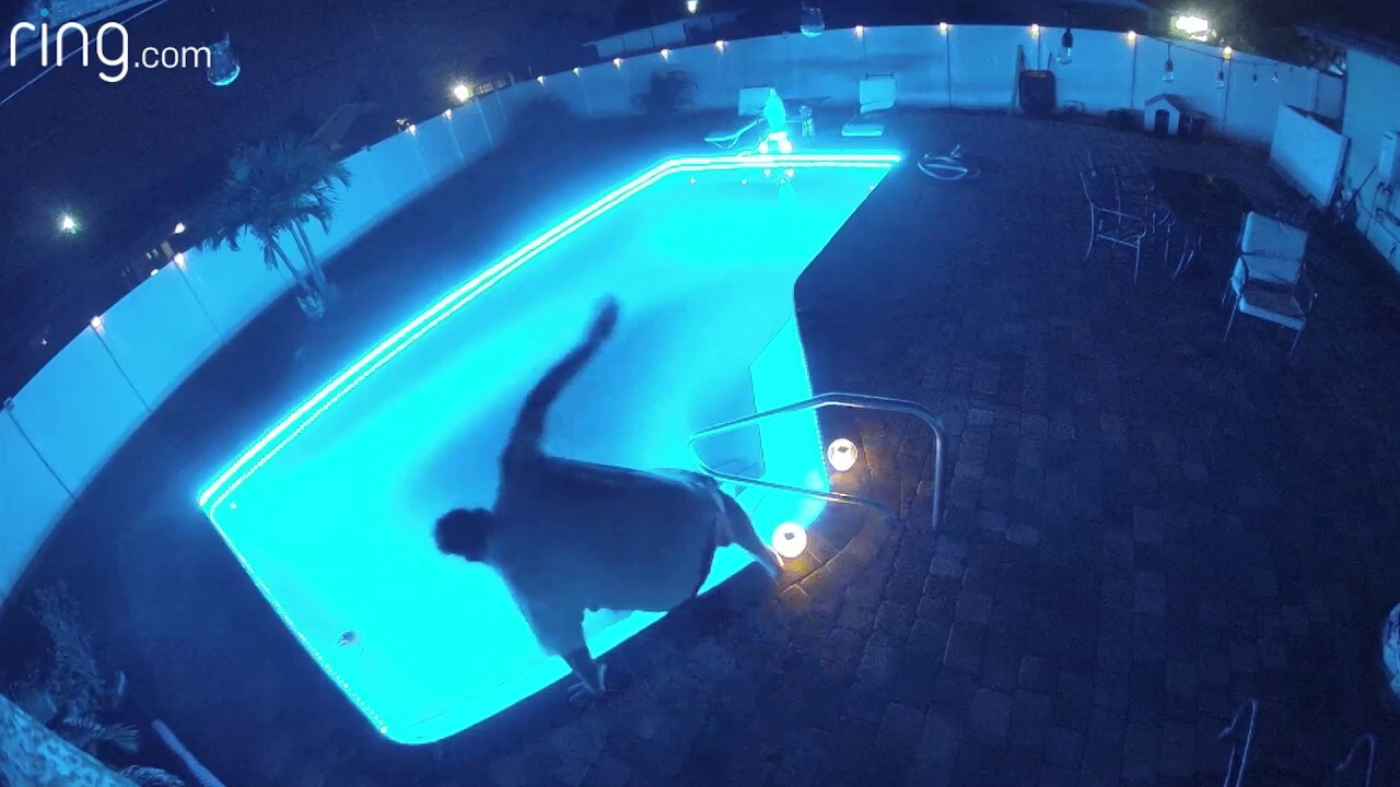 Man drops phone in swimming pool — yells, "No!" as he jumps in after it