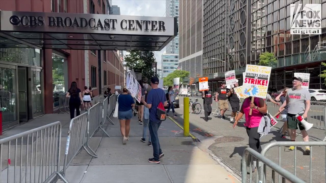 Picketers chant for Drew Barrymore to pay her writers outside CBS Broadcast Center