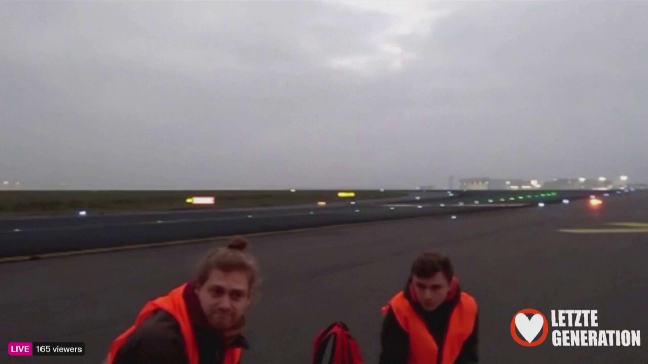 Climate activists glue themselves to Berlin airport runway, disrupting air travel