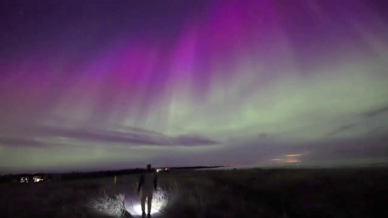 Aurora borealis lights up evening sky in this stunning video