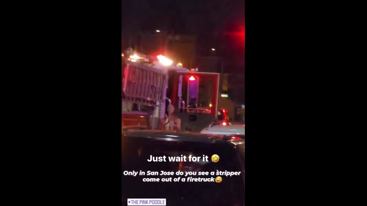 Bikini-clad woman exits fire truck in San Jose, CA