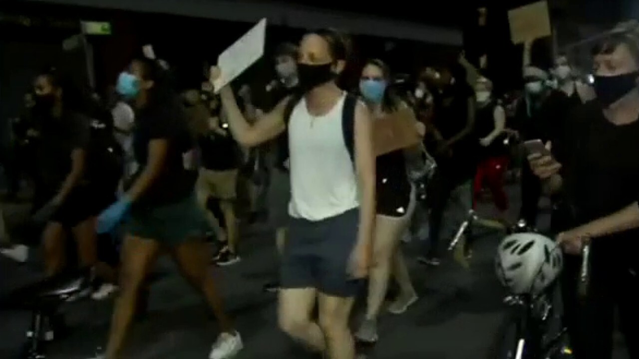 Protesters march in Brooklyn, defy citywide curfew