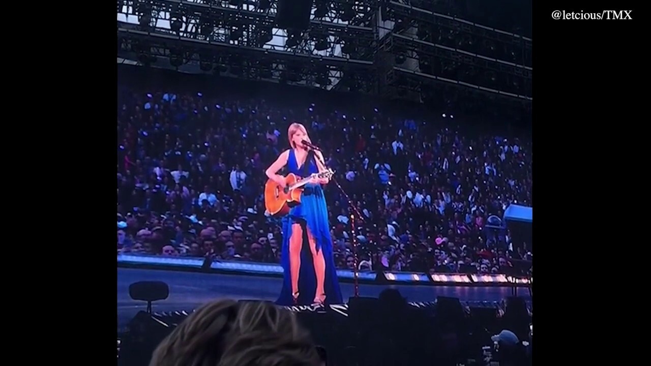 Taylor Swift stops her performance to help a fan
