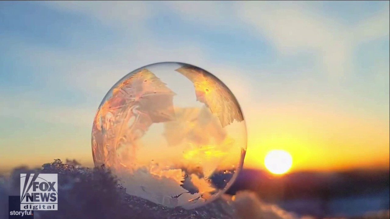 Mesmerizing! Watch cool ice crystals form on a soap bubble amid freezing temperatures