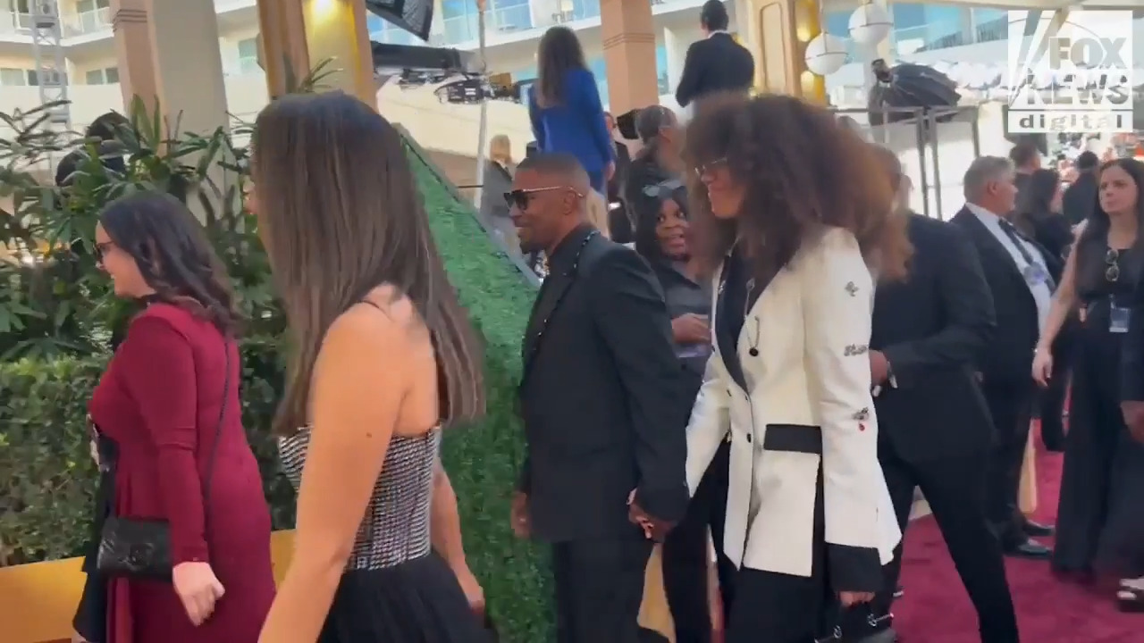 Jamie Foxx walks the red carpet at the 2025 Golden Globe Awards