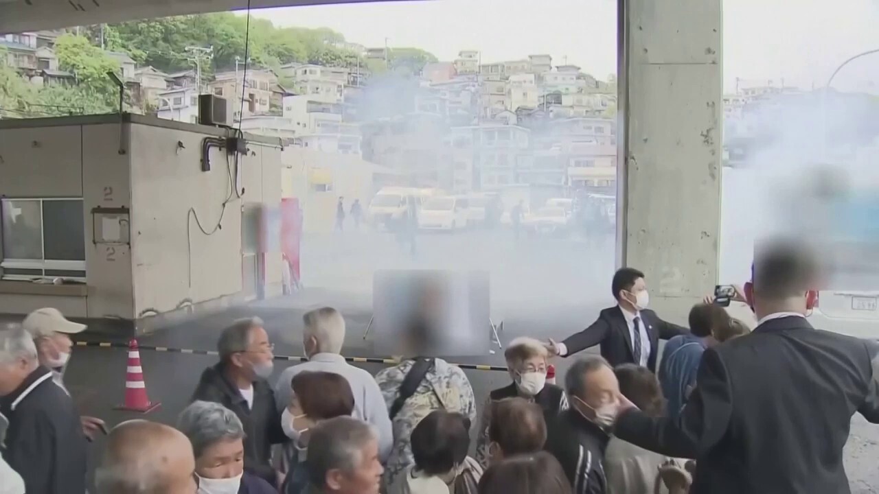 Japan smoke bomb suspect tackled as prime minister is evacuated