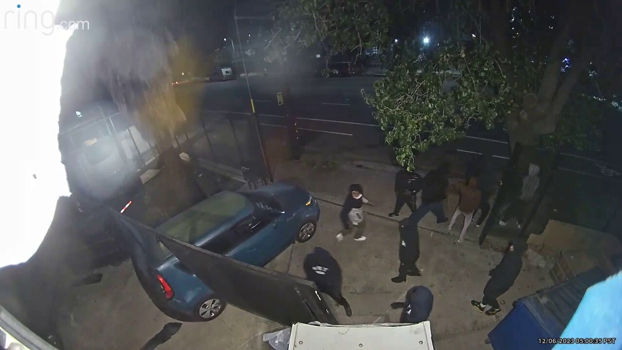 Surveillance video shows brazen burglars crash stolen car through security gate in $100K heist