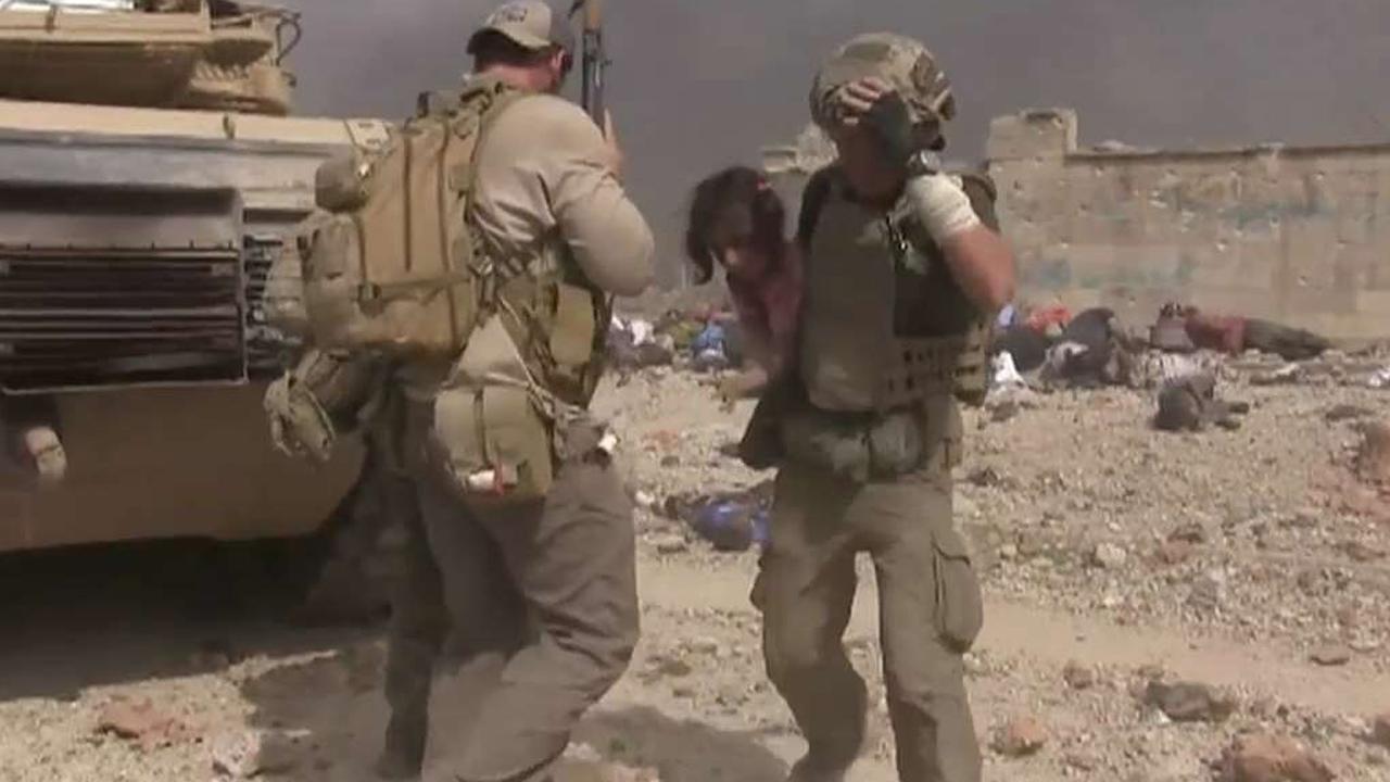 Watch aid worker risk his life to save little girl in Mosul