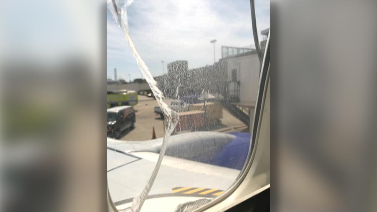 Southwest flight diverted after passenger window cracks