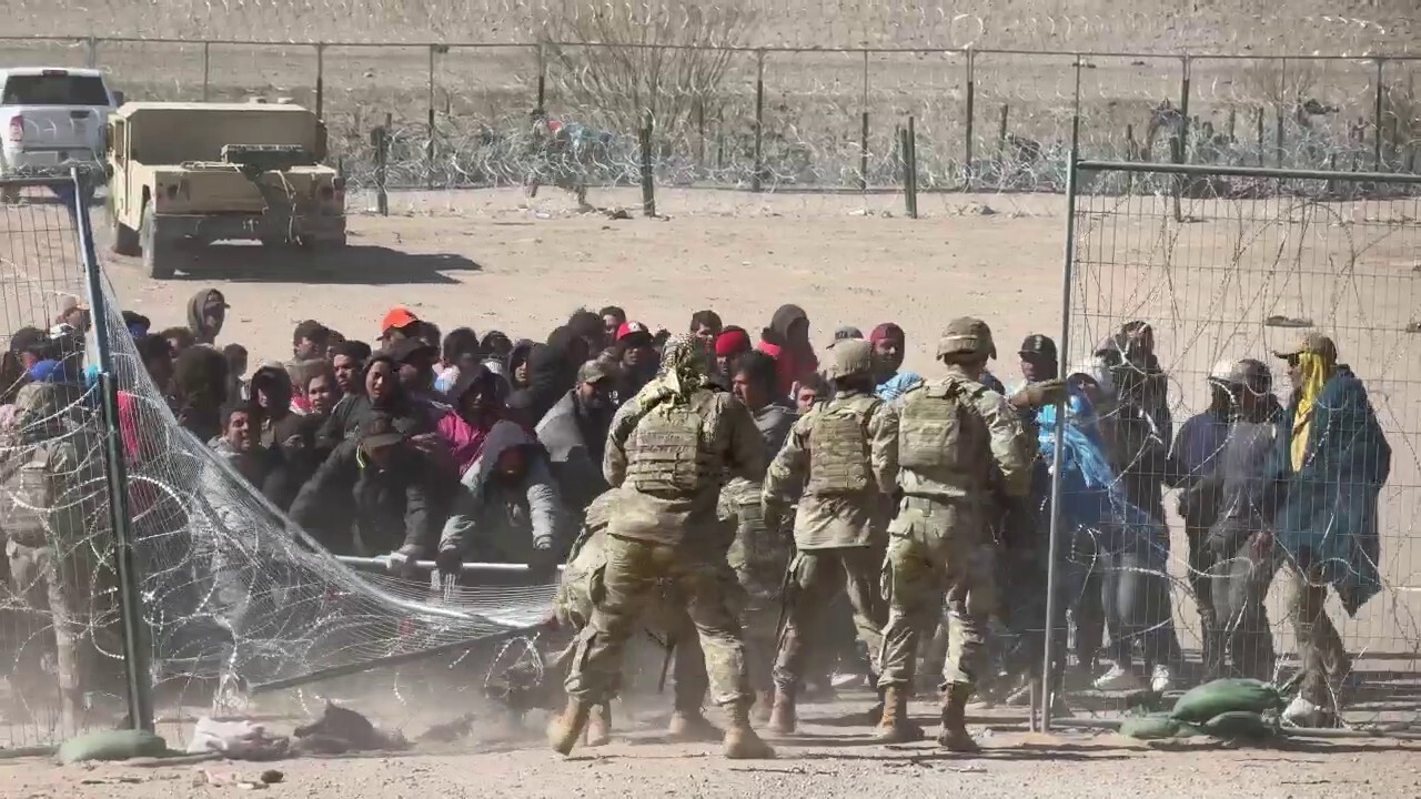 Migrants crash through Texas border security barriers amid legal standoff