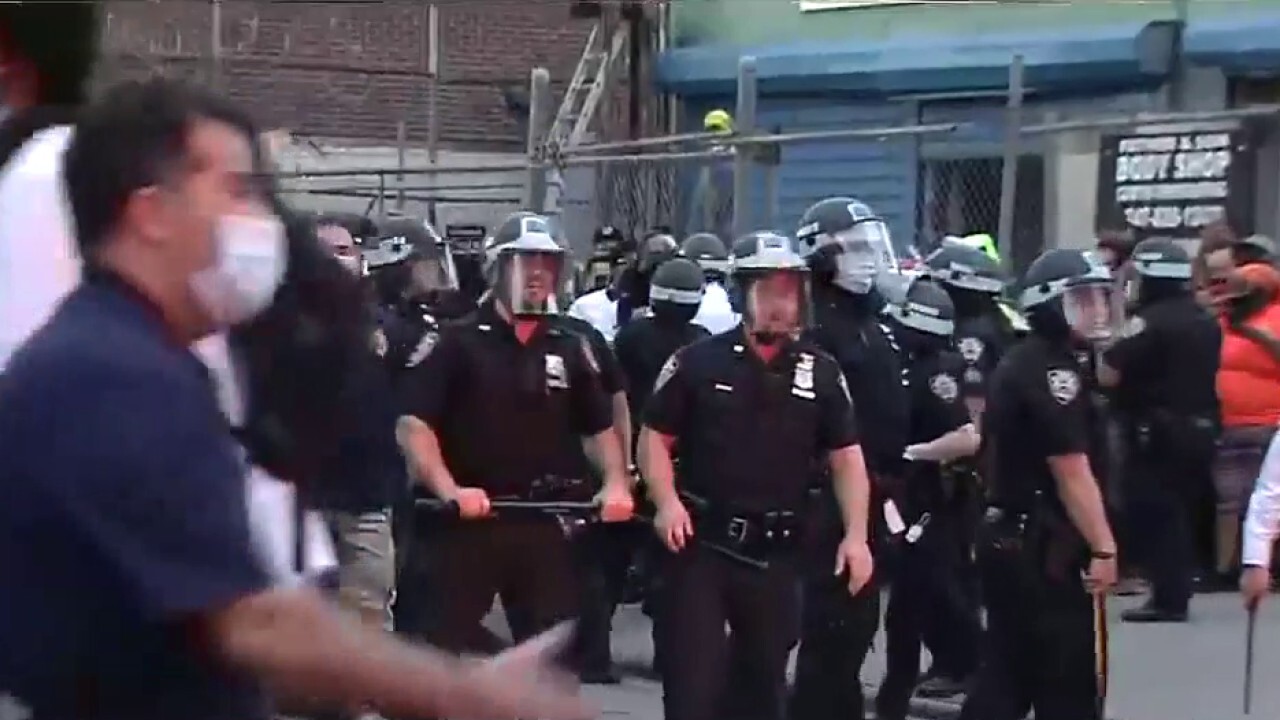 Chaos builds in Brooklyn, officer injured