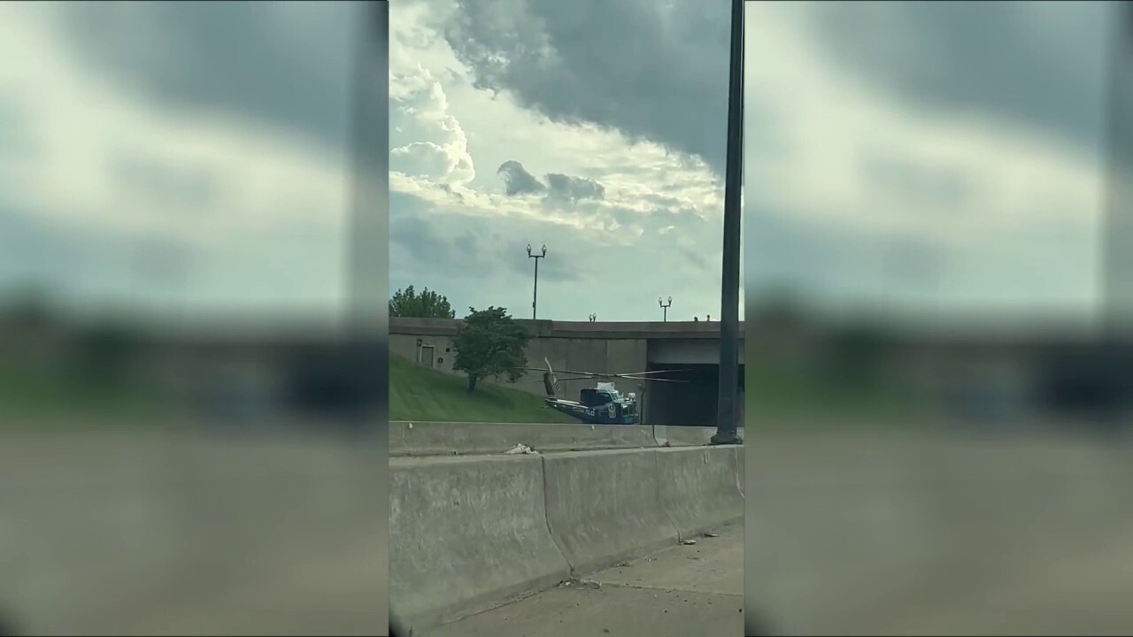 US Park Police helicopter lands on freeway to rescue motorcycle officer after accident