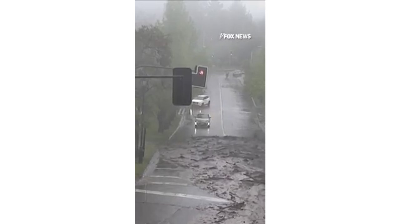 Flash floods sweep cars through the streets of Chile’s capital