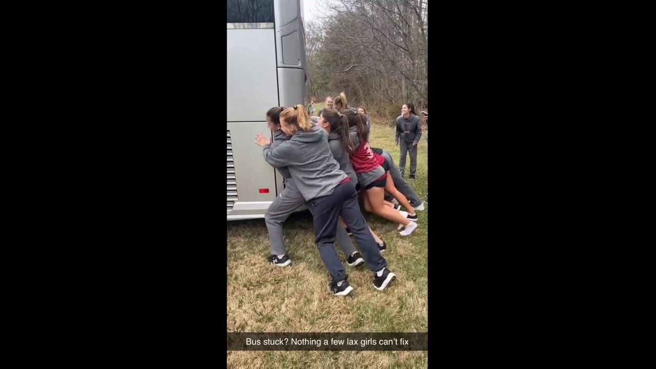 Women's lacrosse team saves the day — pushes bus out of mud