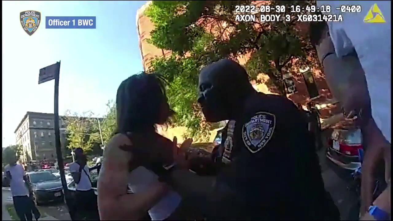 NYPD cop strikes woman interfering in arrest of attempted murder suspect.