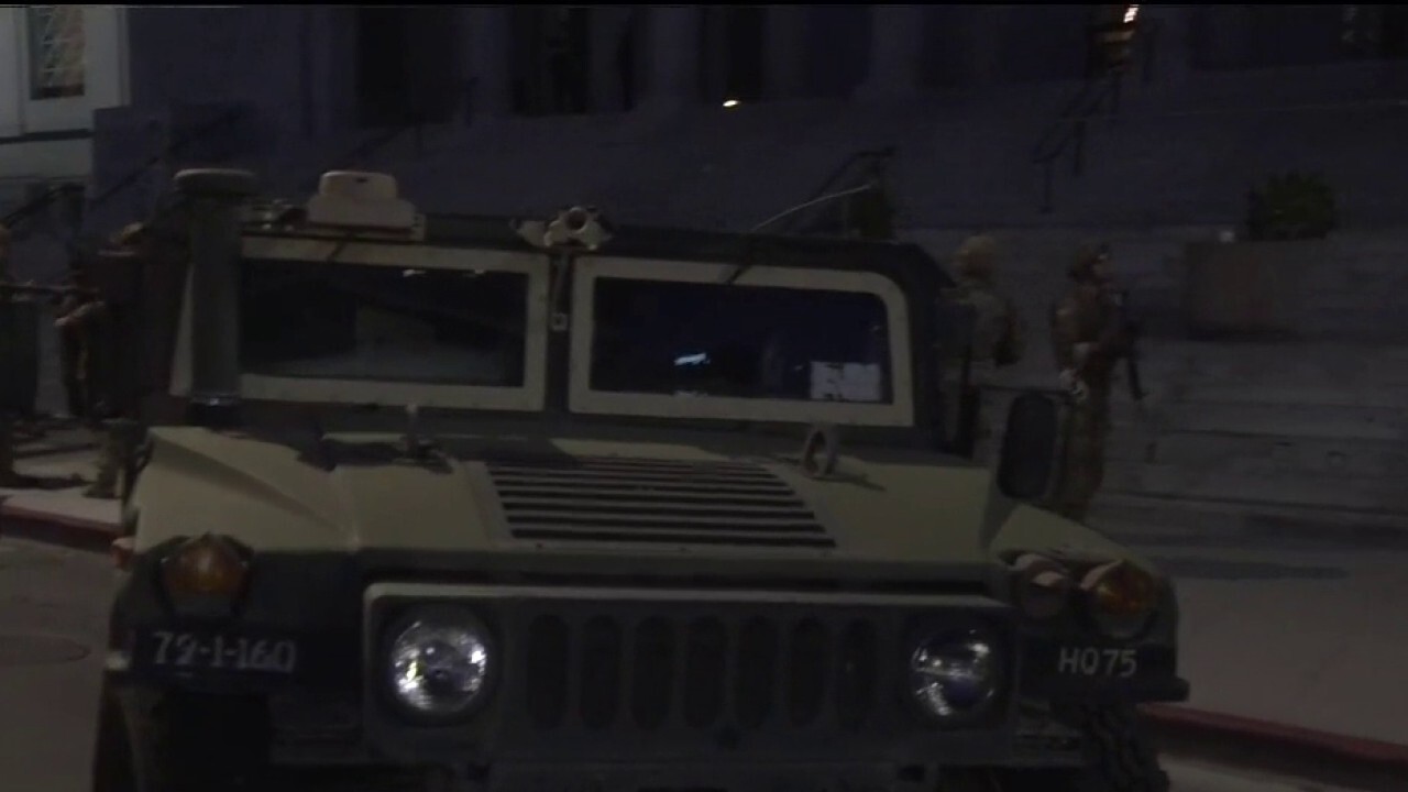 National Guard vehicles stage outside City Hall in Los Angeles	