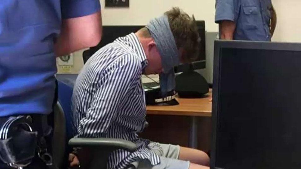 Leaked photo shows teen accused of killing Italian police officer illegally blindfolded at station